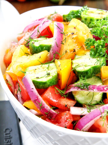 This Simple and Fresh Cucumber Tomato Garden Salad is amazingly refreshing and scrumptious! It's usually not summer for us if we haven't enjoyed this salad made from fresh, organically homegrown, crispy garden veggies.