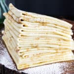 Crepes are a thin, delicate pancakes made from a batter containing flour (like all-purpose, gluten-free flour blend, wheat, or buckwheat), eggs, melted butter, salt, milk, and sometimes sugar and flavorings.